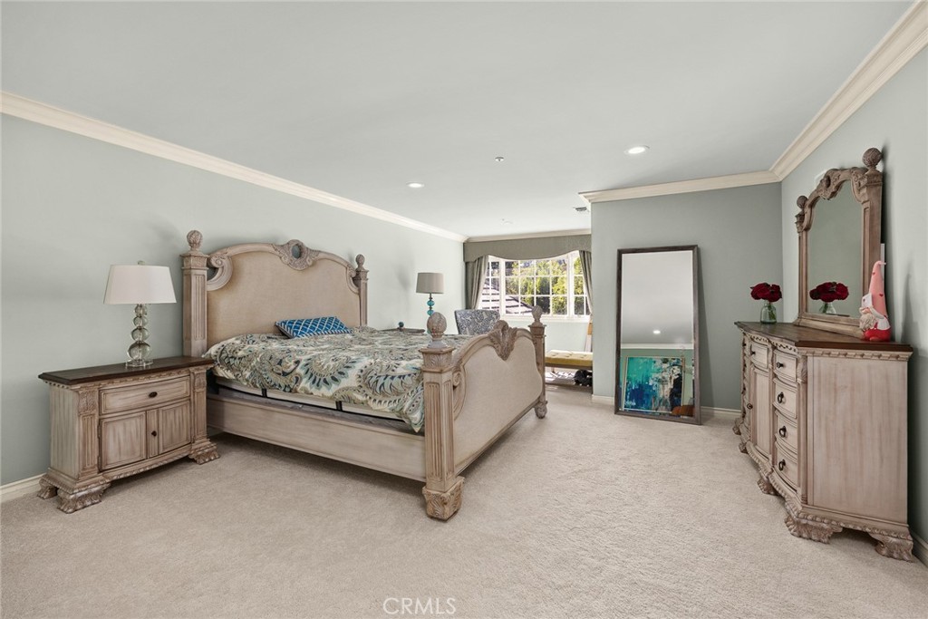 1531 Rodeo Road Arcadia, CA 91006 - Photo 19 of 34 a spacious bedroom with a bed a dresser and mirror