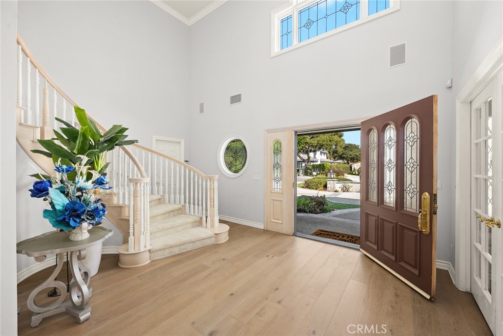 1531 Rodeo Road Arcadia, CA 91006 - Photo 2 of 34 a view of an entryway with wooden floor and a potted plant