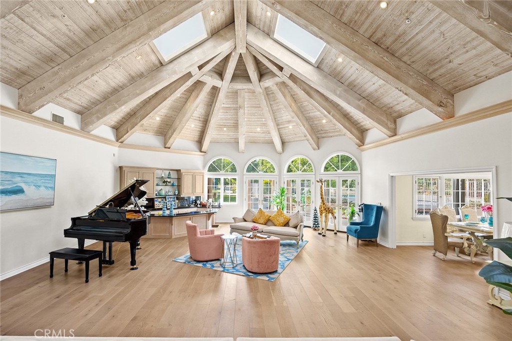 1531 Rodeo Road Arcadia, CA 91006 - Photo 10 of 34 a living room with furniture a fireplace and large windows