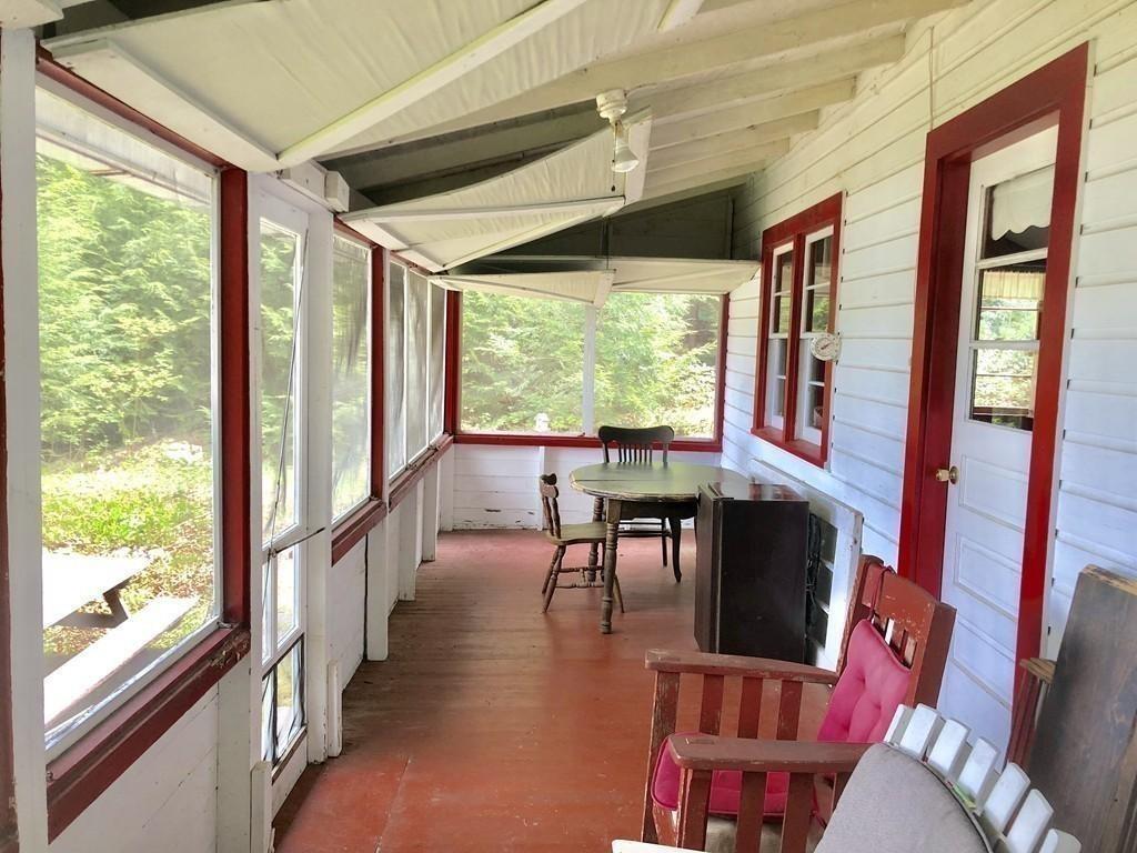21 Farmhouse Road Chesterfield, MA 01012 - Photo 7 of 26 a view of a large dining room with furniture large windows and wooden floor