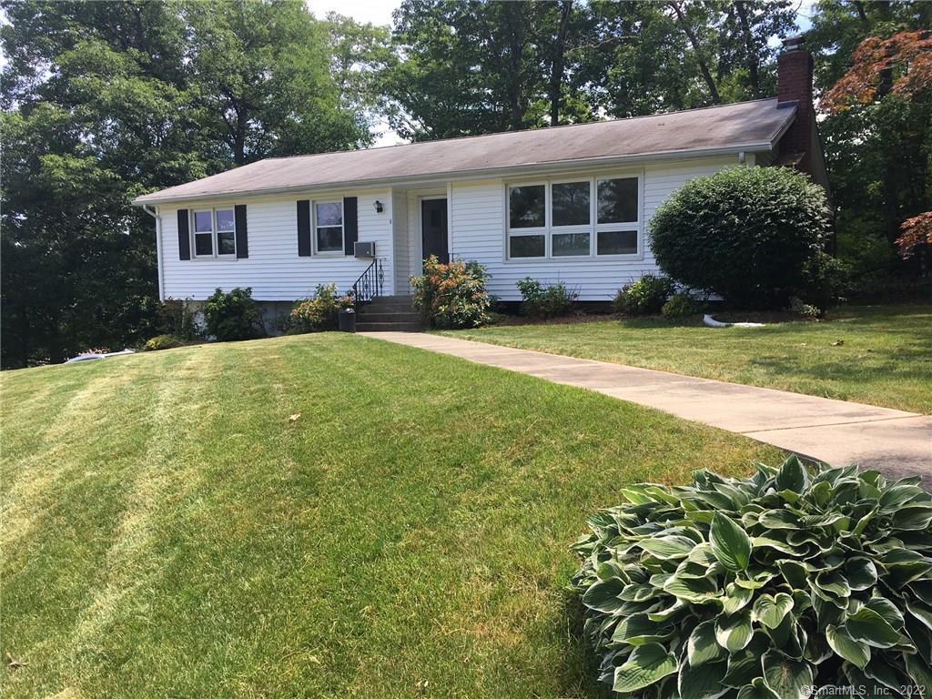 8 Jennifer Road Hamden, CT 06514 - Photo 1 of 1 a view of a house with a yard and plants