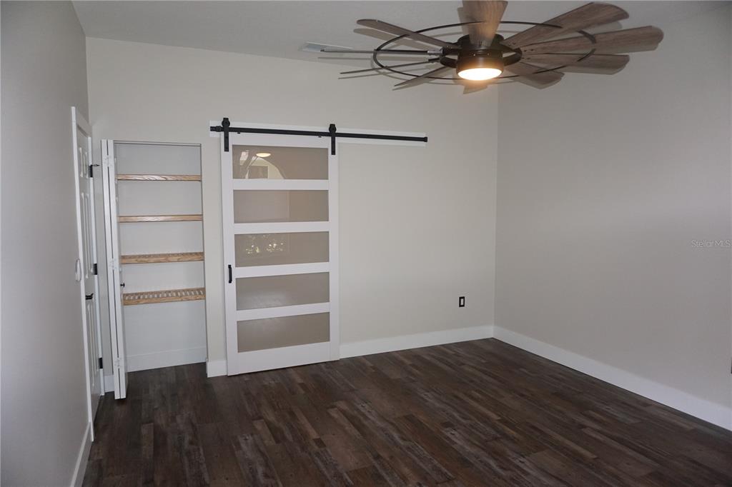 6722 Southwest 111th Loop Ocala, FL 34476 - Photo 23 of 51 FROSTED POCKET DOOR TO ENSUITE, LINEN CLOSET