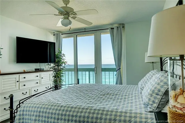 a view of a swimming pool with a table and chairs
