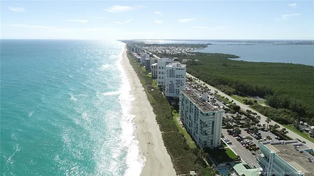 a dining room with furniture and a flat screen tv