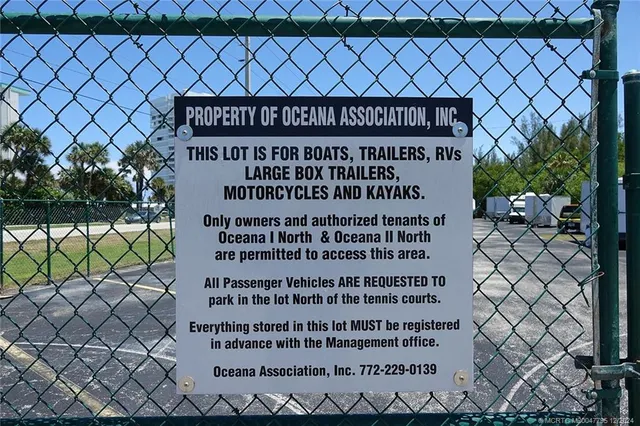 a view of outdoor space with seating area and car parked