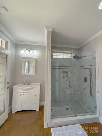a view of a bathroom with a glass door