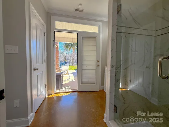 a bed room with a bed and a chandelier