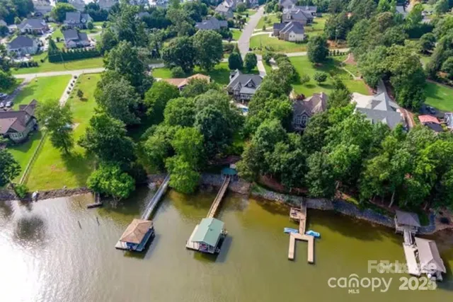 a view of swimming pool with a yard and plants