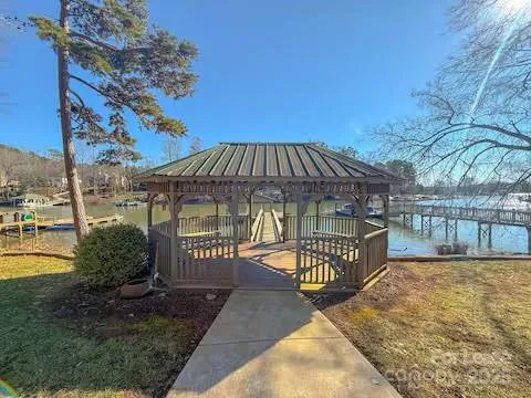 a balcony with wooden floor and outdoor space
