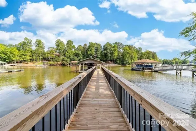 a view of swimming pool with outdoor seating and barbeque oven