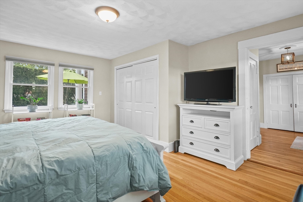 201 Humphrey Street, Unit 2 Marblehead, MA 01945 - Photo 17 of 33 a bedroom with a bed and a flat screen tv