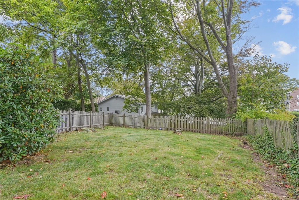 201 Humphrey Street, Unit 2 Marblehead, MA 01945 - Photo 26 of 33 a house with a tree in front of it