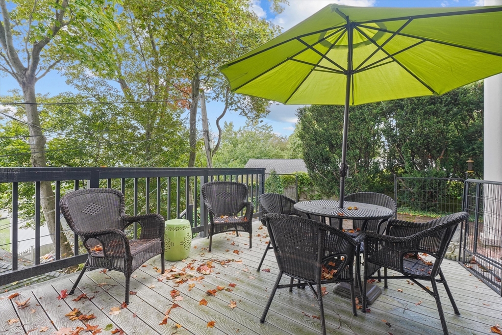 201 Humphrey Street, Unit 2 Marblehead, MA 01945 - Photo 28 of 33 a view of a patio on the deck and a backyard
