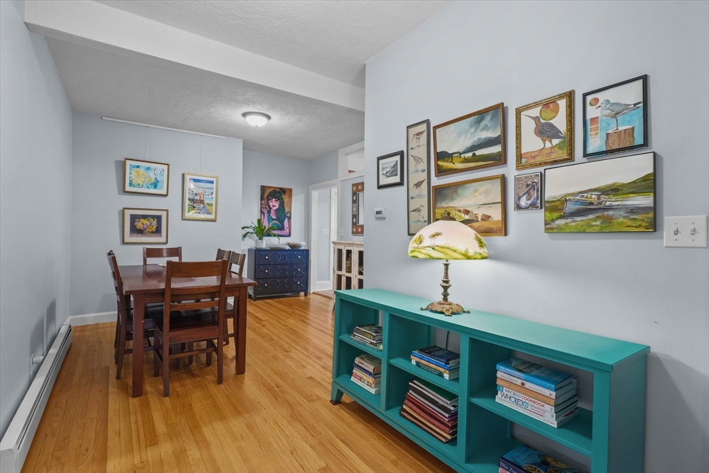 201 Humphrey Street, Unit 2 Marblehead, MA 01945 - Photo 7 of 33 a view of a workspace with furniture and wooden floor
