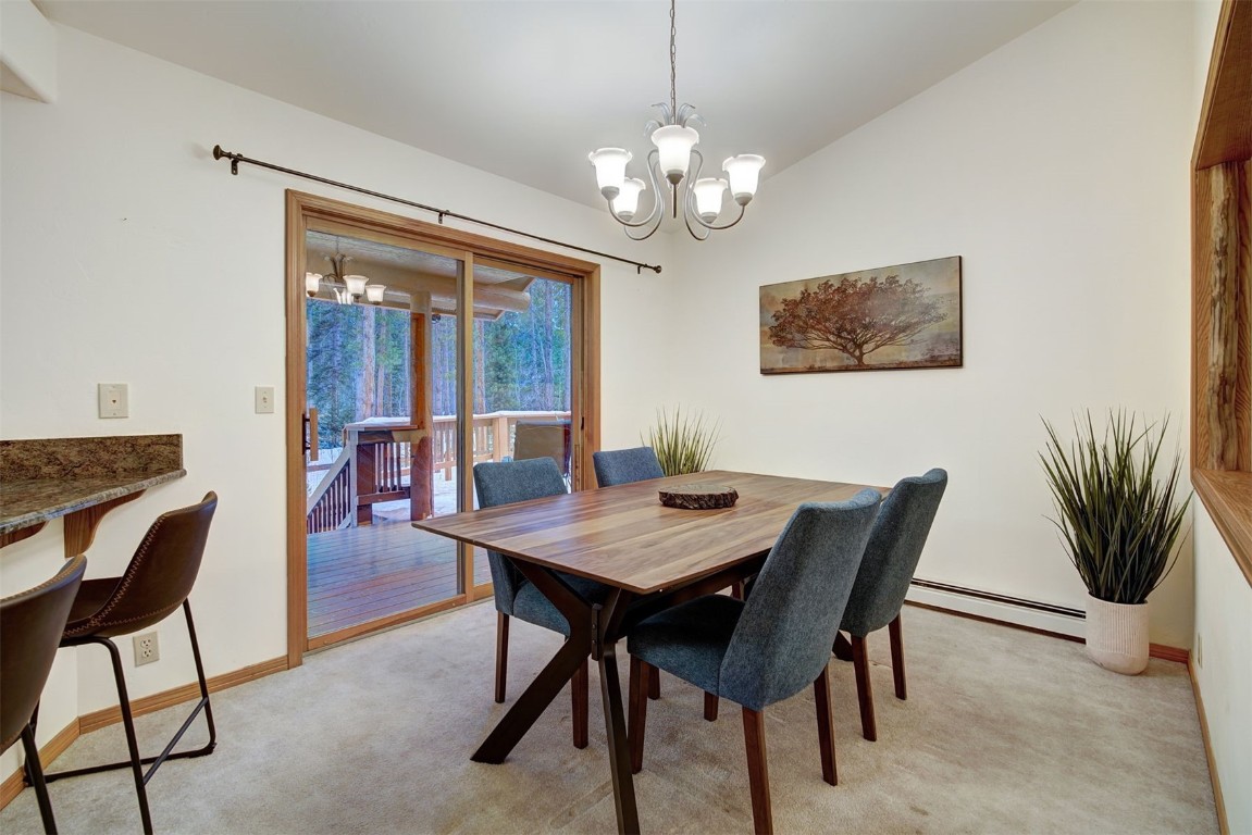 3824 Ski Hill Road Breckenridge, CO 80424 - Photo 12 of 47 a view of a dining room with furniture window and wooden floor