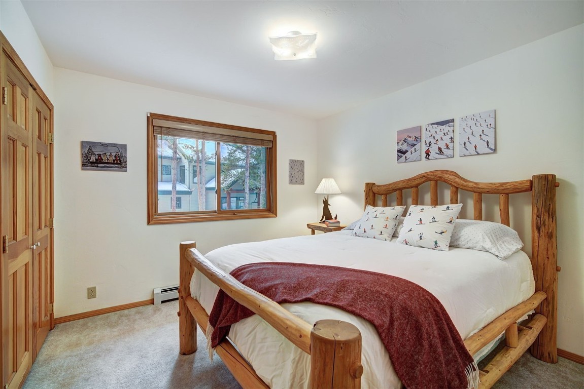 3824 Ski Hill Road Breckenridge, CO 80424 - Photo 22 of 47 a bedroom with a bed and a window