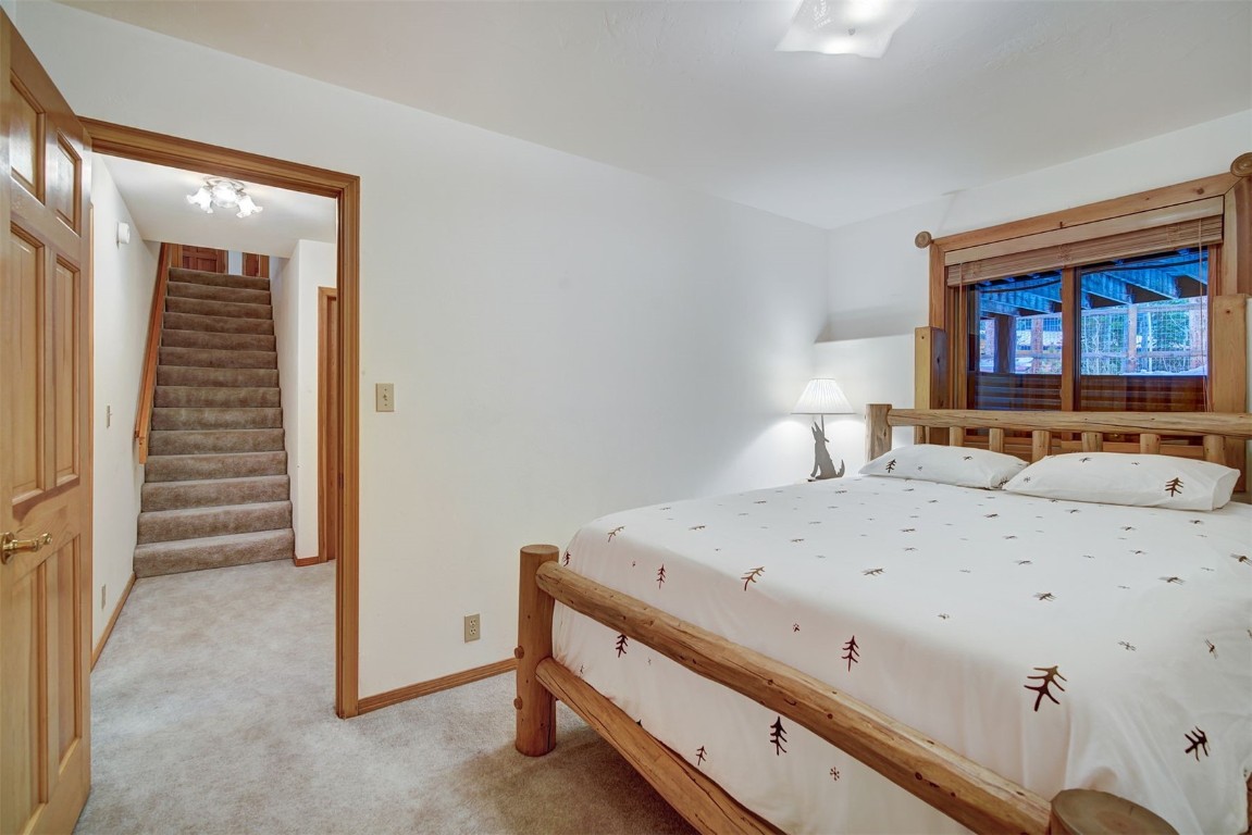 3824 Ski Hill Road Breckenridge, CO 80424 - Photo 27 of 47 a room with a bed and a dresser