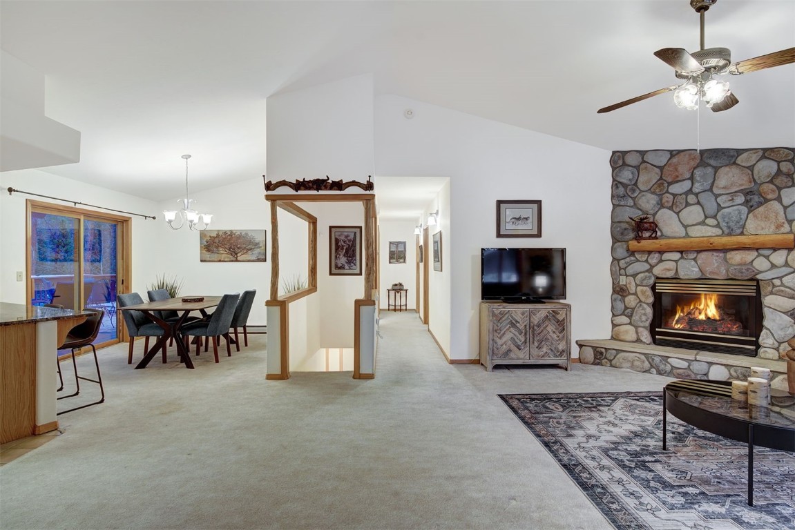 3824 Ski Hill Road Breckenridge, CO 80424 - Photo 7 of 47 a living room with furniture a flat screen tv and a fireplace