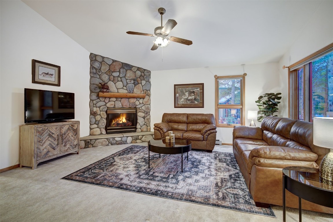 3824 Ski Hill Road Breckenridge, CO 80424 - Photo 8 of 47 a living room with furniture a flat screen tv and a fireplace