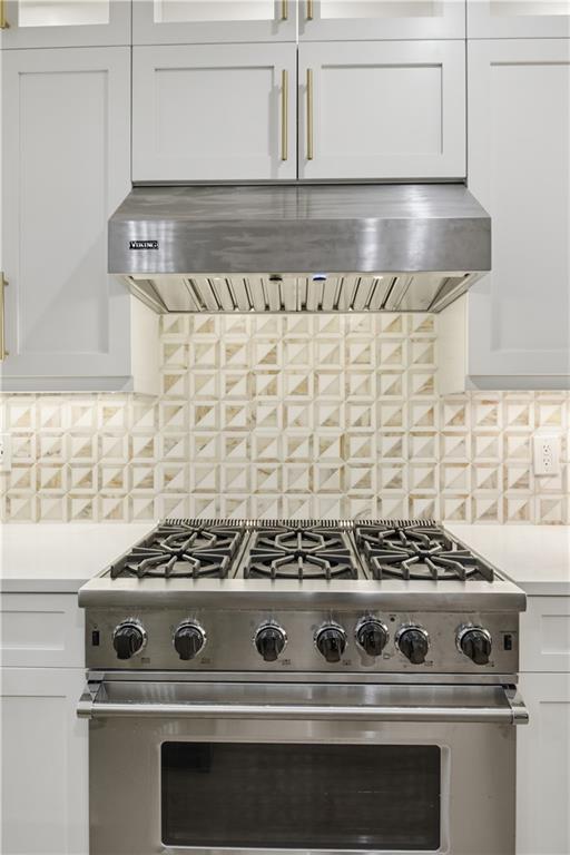 3842 Memphis Drive Suwanee, GA 30024 - Photo 11 of 63 a stove top oven sitting inside of a kitchen