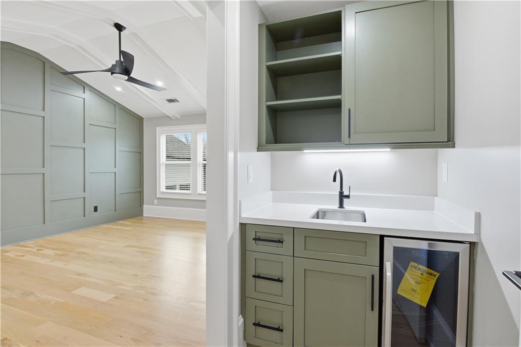 3842 Memphis Drive Suwanee, GA 30024 - Photo 19 of 63 a kitchen with a sink and cabinets