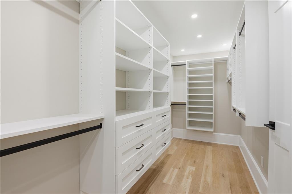 3842 Memphis Drive Suwanee, GA 30024 - Photo 25 of 63 a view of walk in closet with empty racks