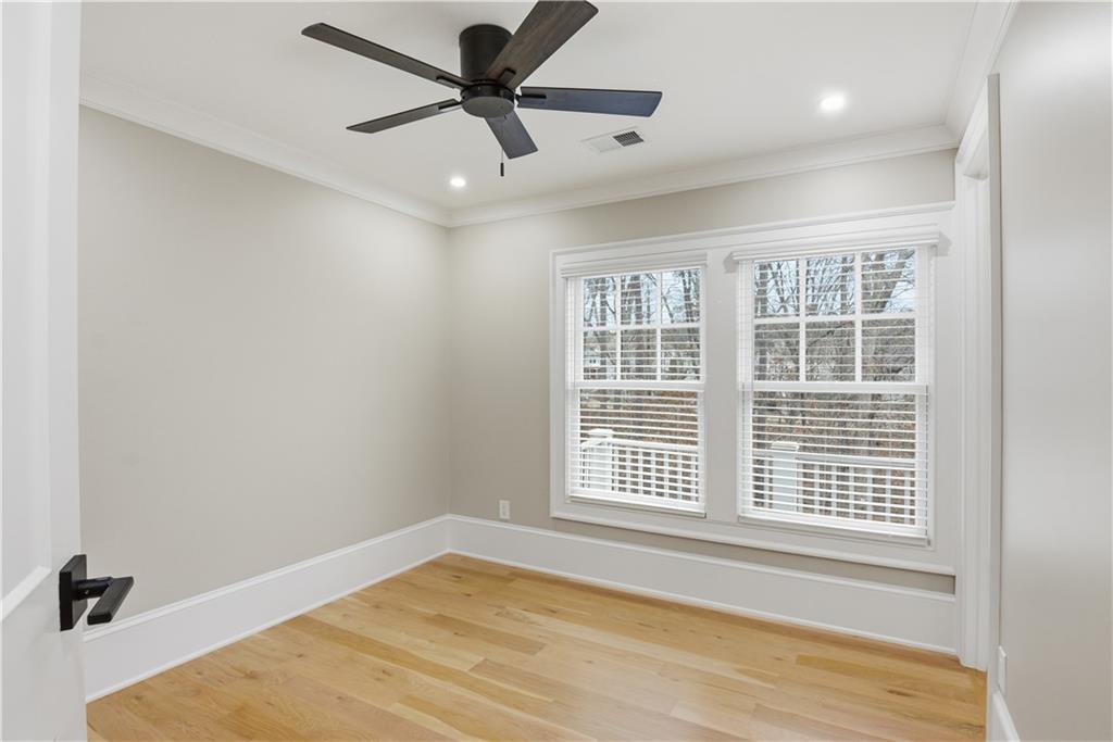 3842 Memphis Drive Suwanee, GA 30024 - Photo 30 of 63 an empty room with a window and a ceiling fan