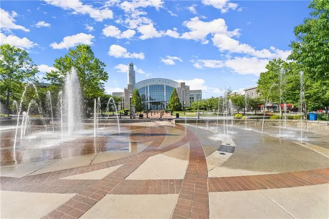 a view of a swimming pool with an outdoor seating