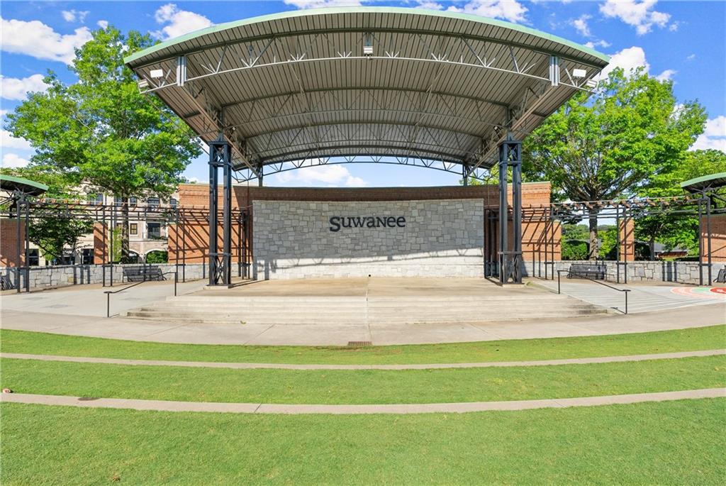 3842 Memphis Drive Suwanee, GA 30024 - Photo 40 of 63 a view of a swimming pool with a bench in patio
