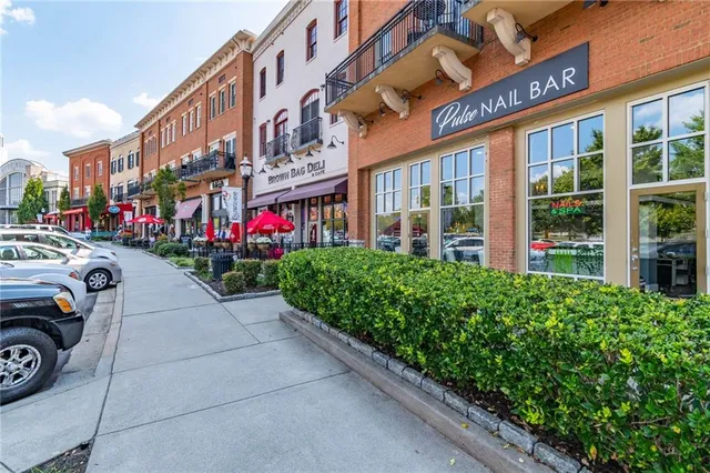 a view of swimming pool with outdoor seating