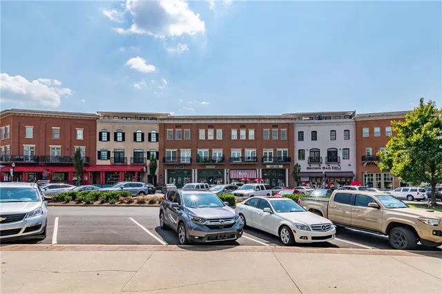 a view of pool with large trees and a big yard