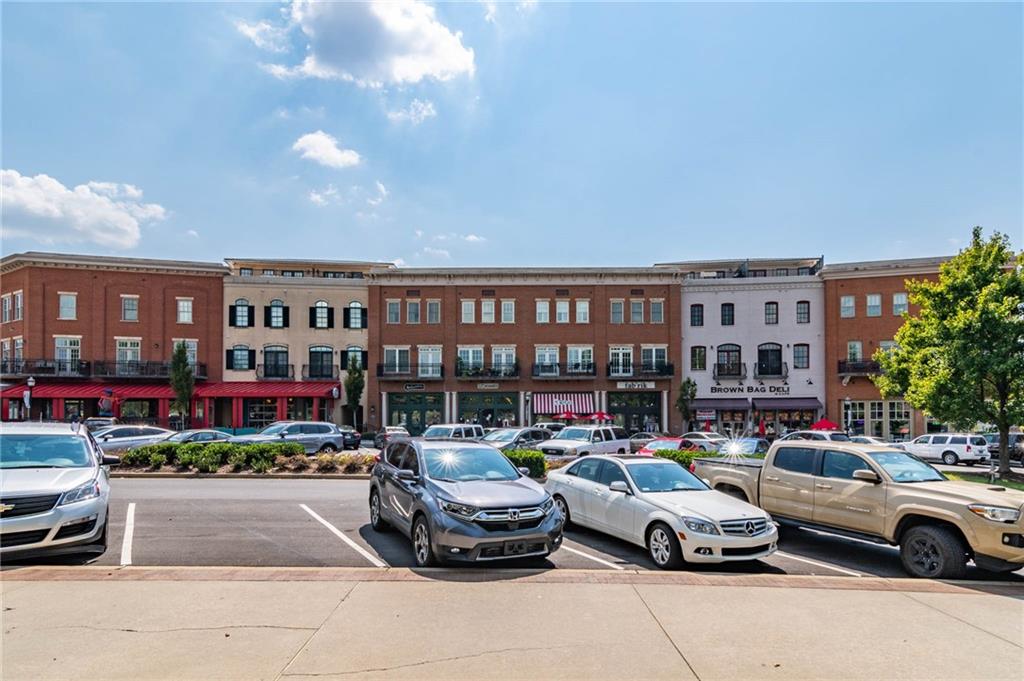 3842 Memphis Drive Suwanee, GA 30024 - Photo 48 of 63 a car parked in front of a building