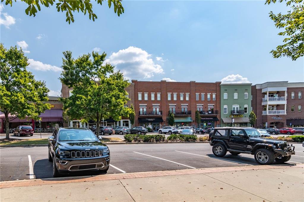 3842 Memphis Drive Suwanee, GA 30024 - Photo 49 of 63 a car parked in front of a building