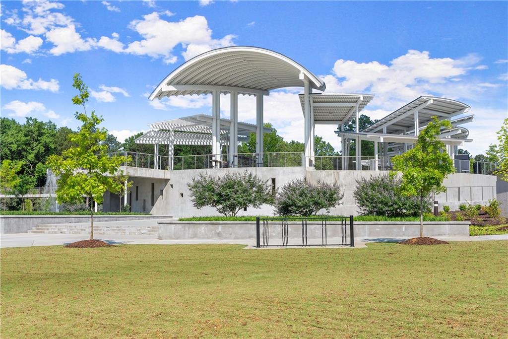 3842 Memphis Drive Suwanee, GA 30024 - Photo 51 of 63 a view of a swimming pool with an outdoor seating
