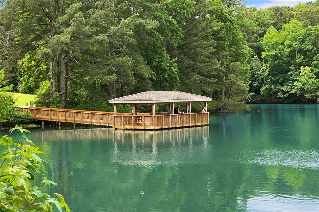 3842 Memphis Drive Suwanee, GA 30024 - Photo 63 of 63 a view of a lake with a yard
