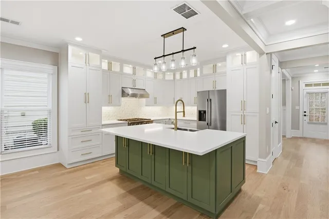a large kitchen with a table and chairs