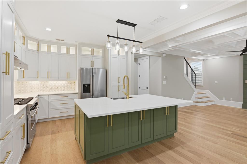 3842 Memphis Drive Suwanee, GA 30024 - Photo 9 of 63 a large kitchen with a table and chairs