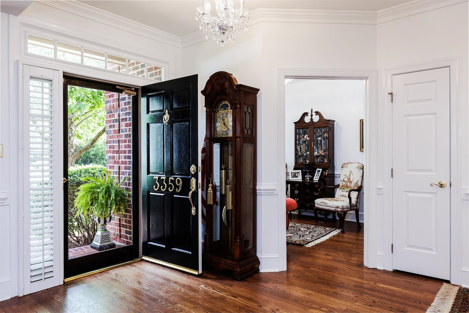 3359 Ridgecrest Court Raleigh, NC 27607 - Photo 4 of 37 a view of a entryway door and hallway with wooden floor