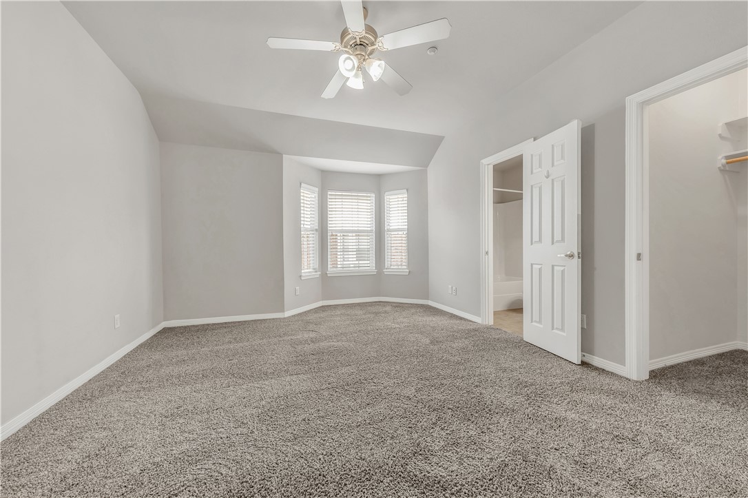 1198 Jones-Butler Road, Unit 907 College Station, TX 77840 - Photo 13 of 23 an empty room with windows and fan