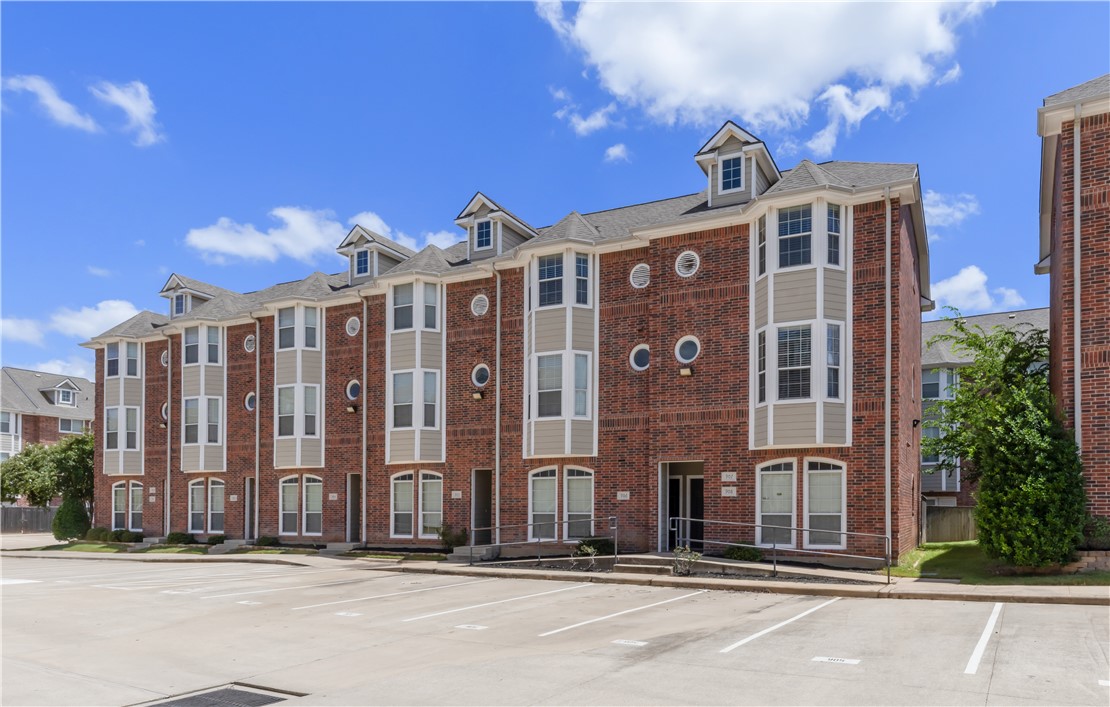 1198 Jones-Butler Road, Unit 907 College Station, TX 77840 - Photo 23 of 23 a front view of a building with a garden and plants