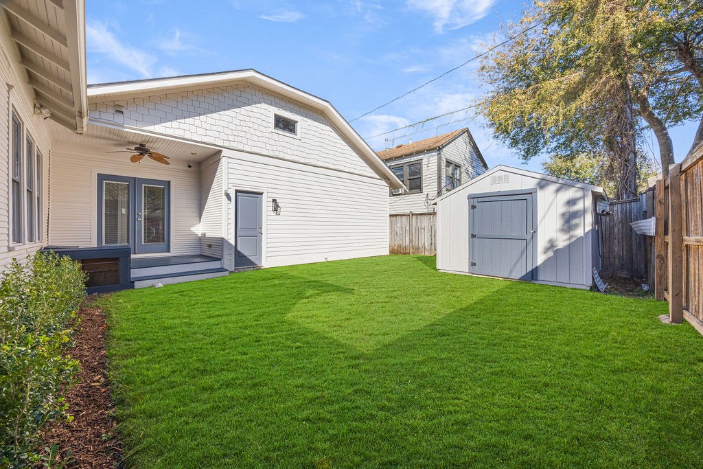 731 Key Street Houston, TX 77009 - Photo 22 of 30 Green backyard ideal for summer BBQ's and gatherings with a convenient outdoor shed for all your home storage needs