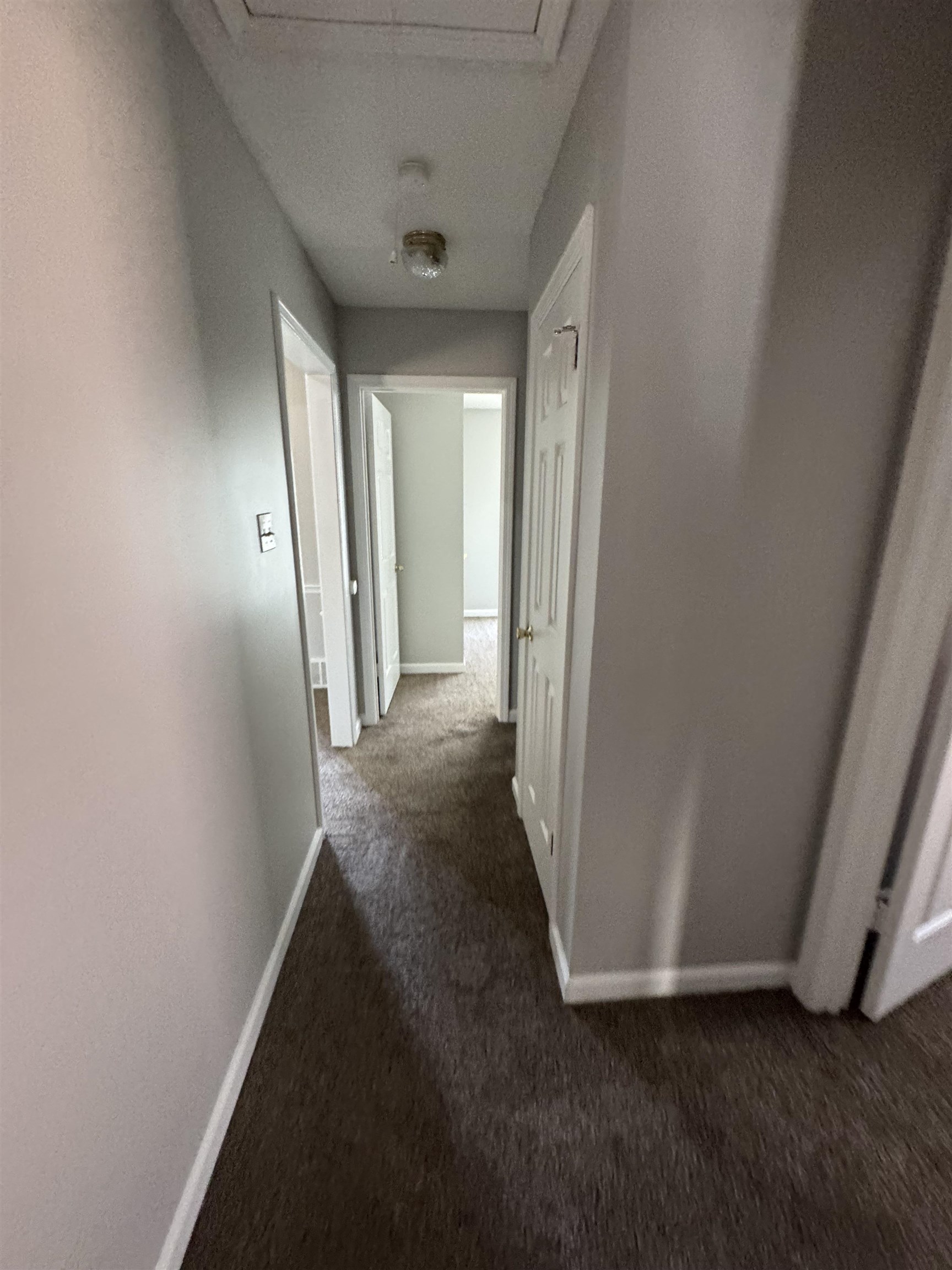 7266 Woodshire Road Memphis, TN 38125 - Photo 12 of 14 Hall featuring dark carpet and baseboards