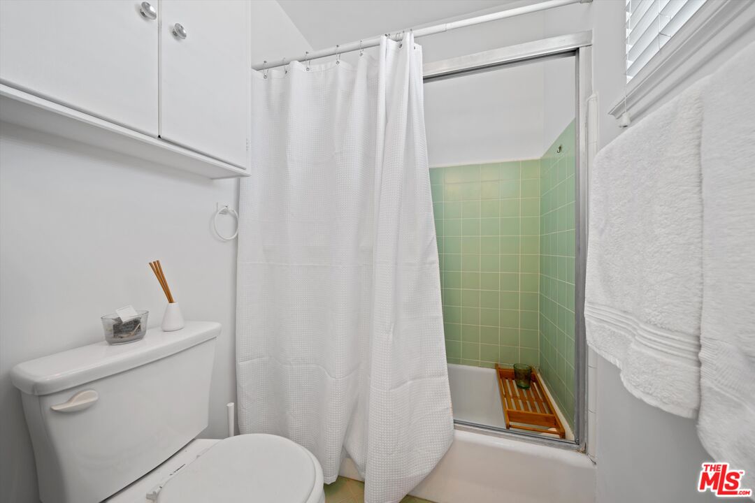 819 East 4th Street, Unit 15 Long Beach, CA 90802 - Photo 13 of 27 a bathroom with a sink and toilet