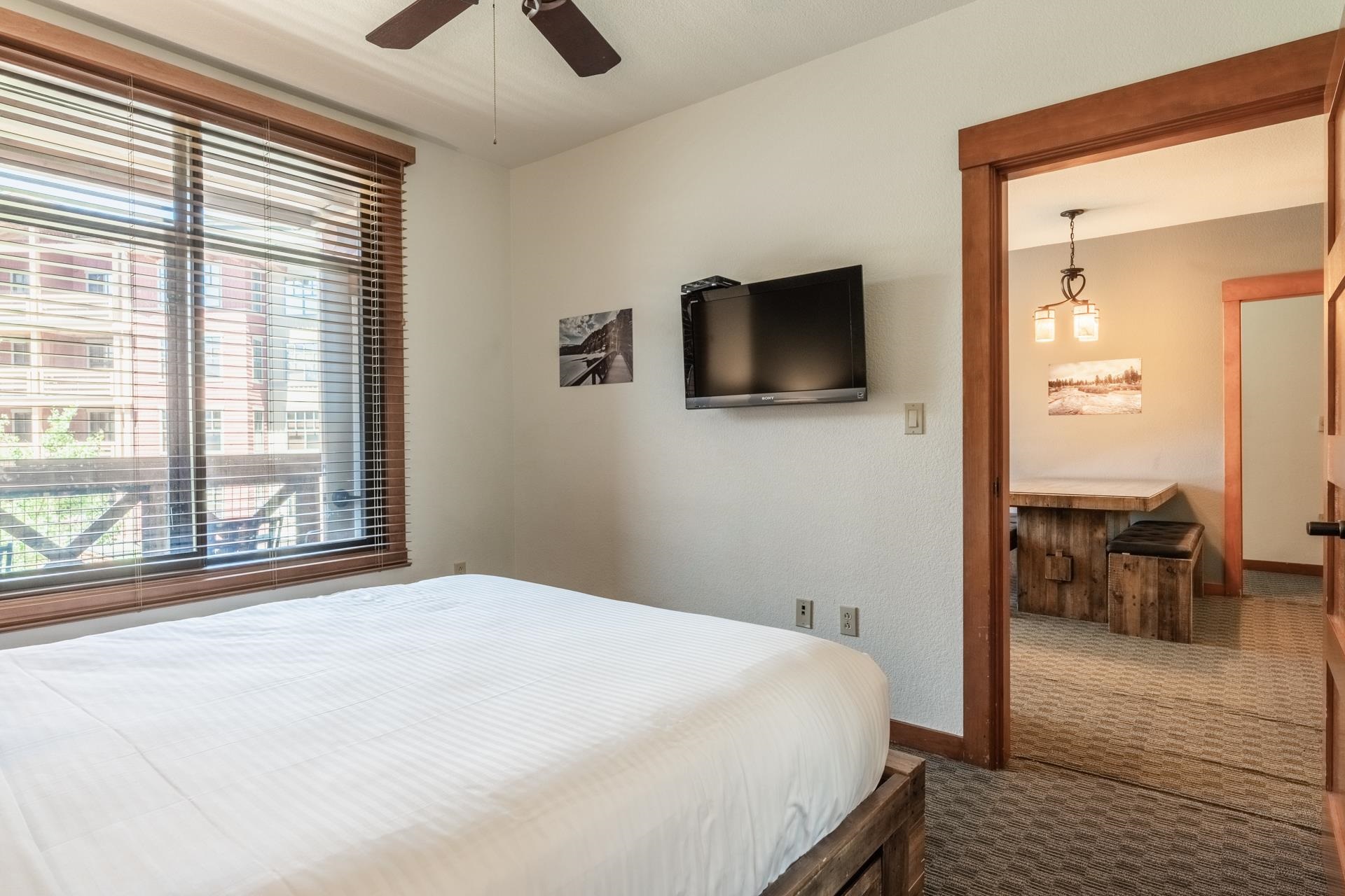 6201 Minaret Road, Unit 2312 Mammoth Lakes, CA 93546 - Photo 22 of 41 a bedroom with a bed and a flat screen tv
