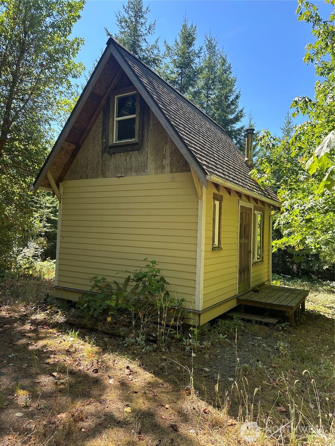 22222-nhn East Quilcene Road Quilcene, WA 98376 - Photo 11 of 39 a view of a house with a yard