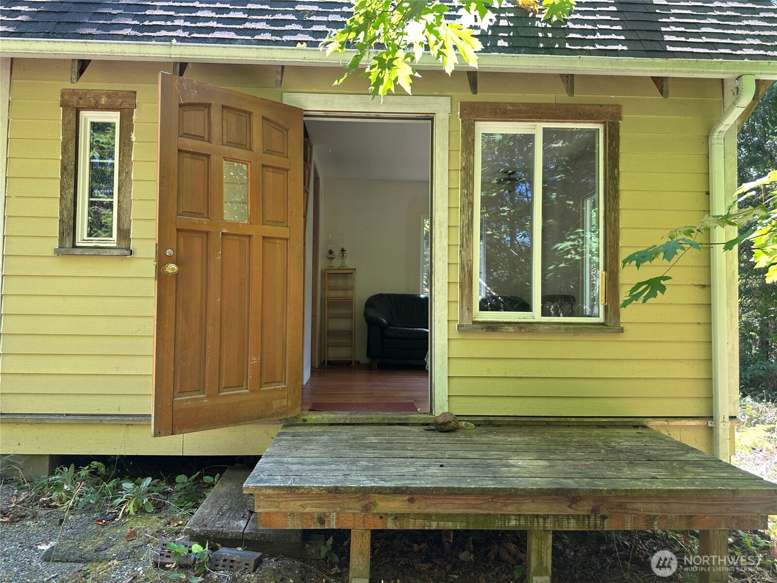 22222-nhn East Quilcene Road Quilcene, WA 98376 - Photo 12 of 39 a view of a house with a door and wooden wall