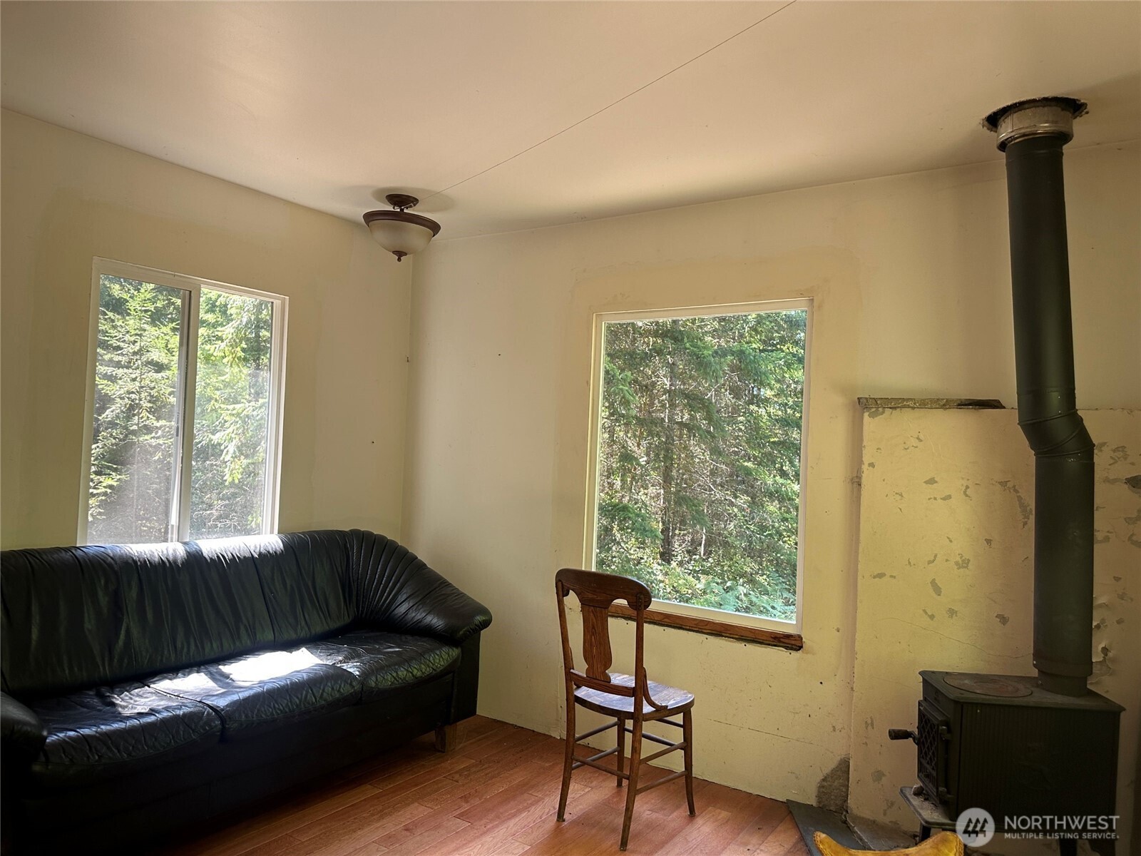 22222-nhn East Quilcene Road Quilcene, WA 98376 - Photo 15 of 39 a living room with furniture and a window