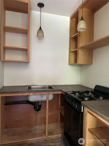 a kitchen with a stove and a cabinet