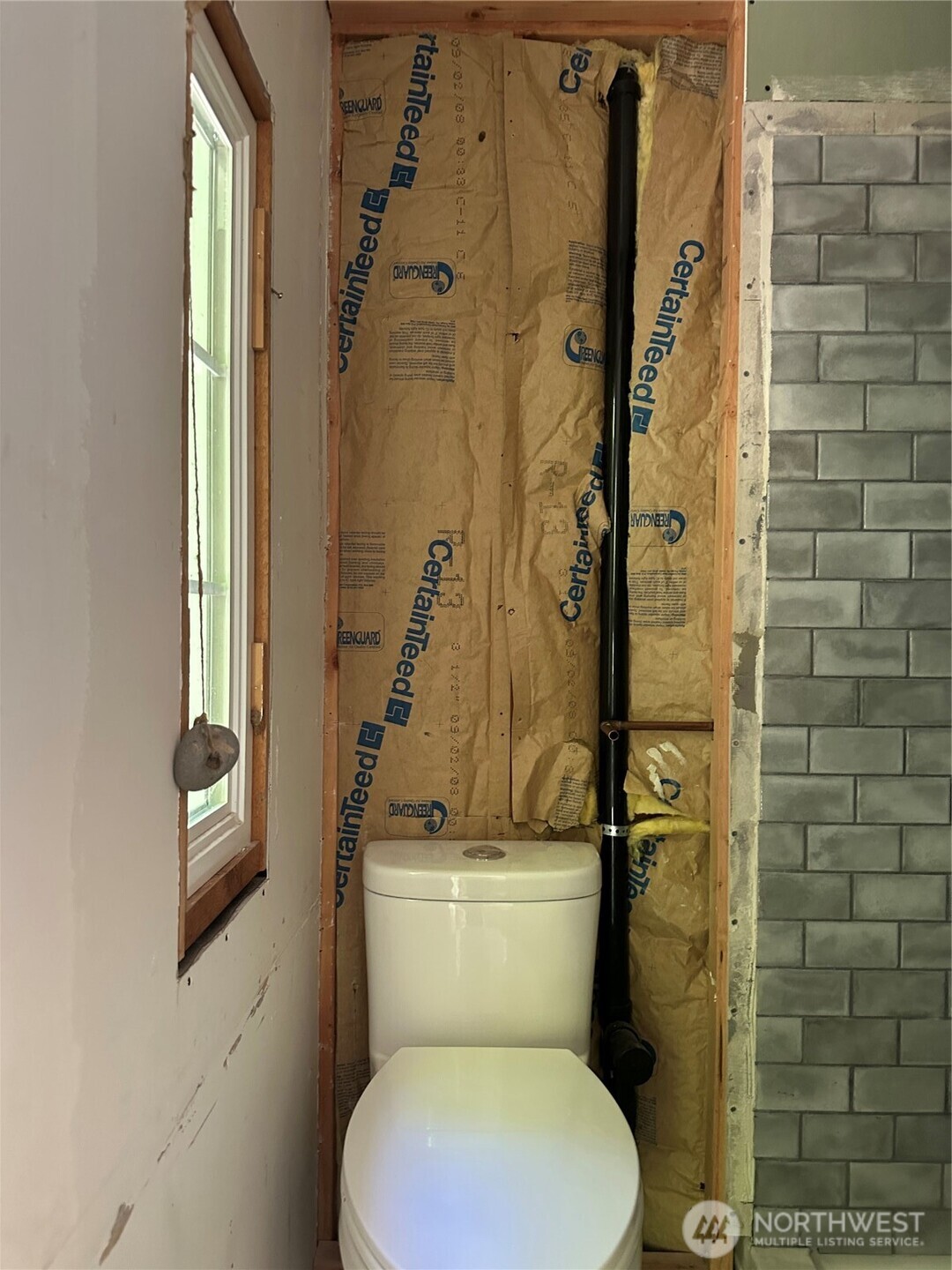 22222-nhn East Quilcene Road Quilcene, WA 98376 - Photo 19 of 39 a white toilet sitting next to a shower