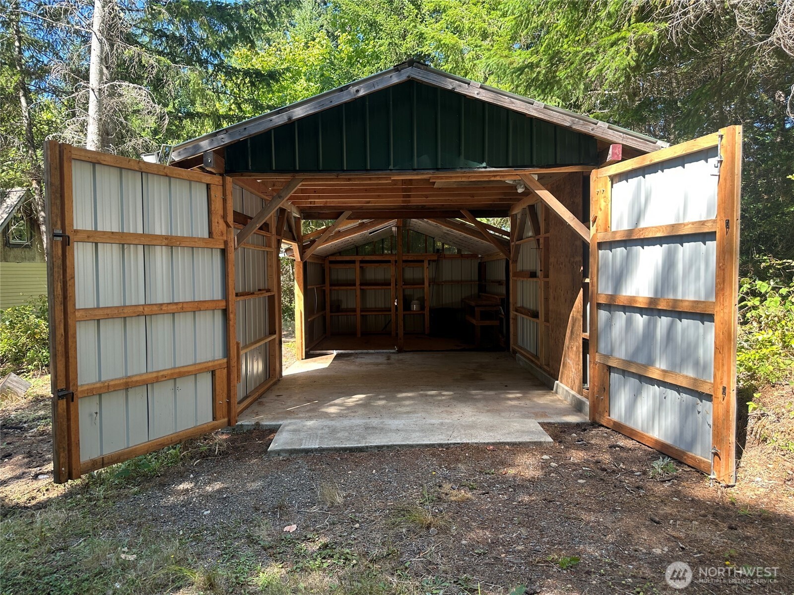22222-nhn East Quilcene Road Quilcene, WA 98376 - Photo 29 of 39 a view of a small house with wooden fence